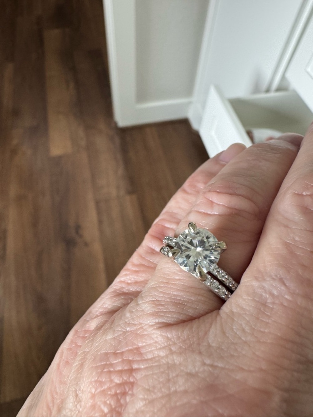 Classic White Gold Round Cut Solitaire Engagement Ring with Pavé Band